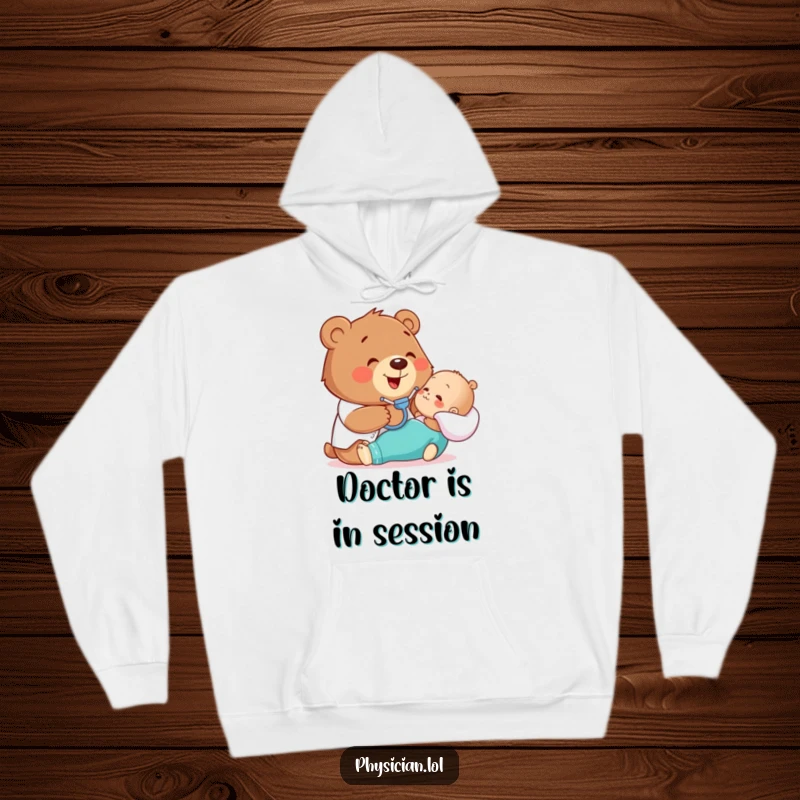 Funny hoodie with a happy bear gently examining a patient with a stethoscope, offering comfort and a dose of humor.